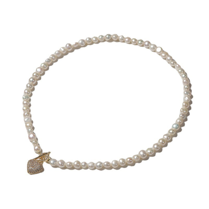 Collier cœur en or avec véritables perles d'eau douce baroques