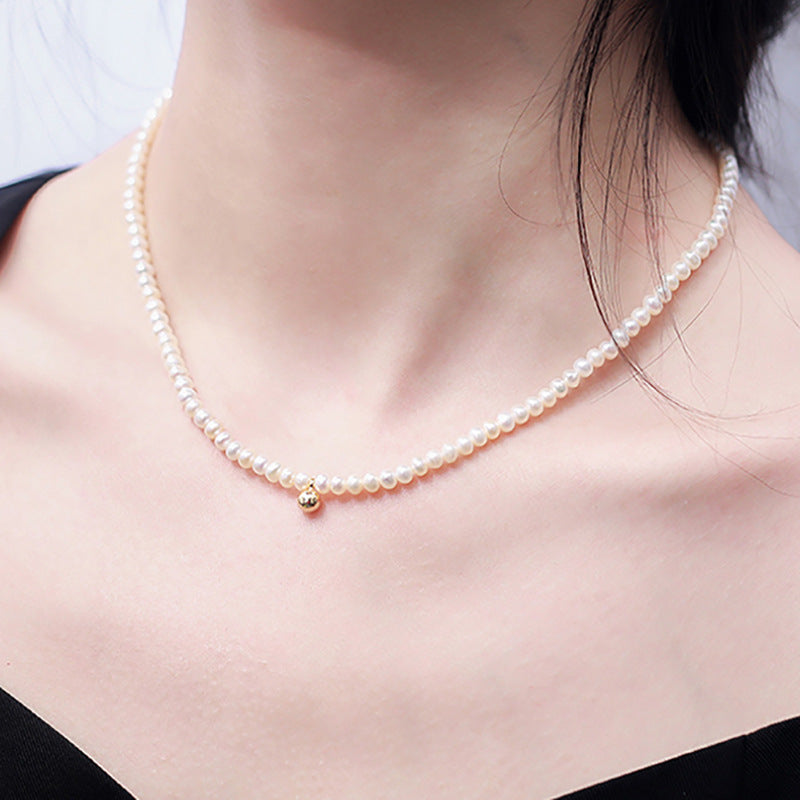 Collar Nikki de oro macizo de 18 quilates con auténtica perla de agua dulce