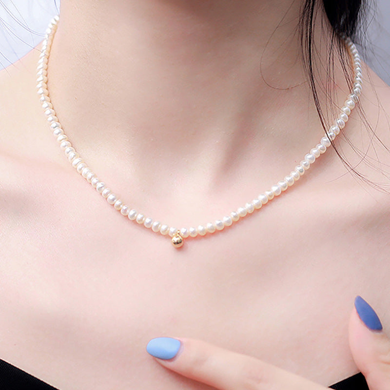 Collar Nikki de oro macizo de 18 quilates con auténtica perla de agua dulce