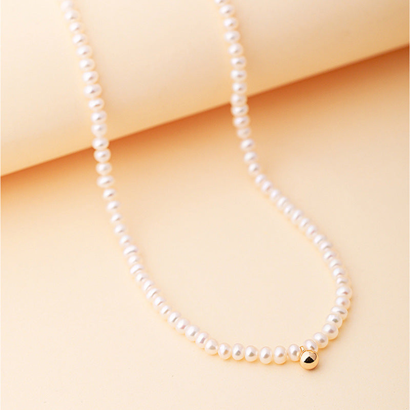 Collar Nikki de oro macizo de 18 quilates con auténtica perla de agua dulce