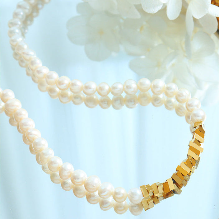 Collar moderno para dama de acero y titanio con auténtica perla de agua dulce