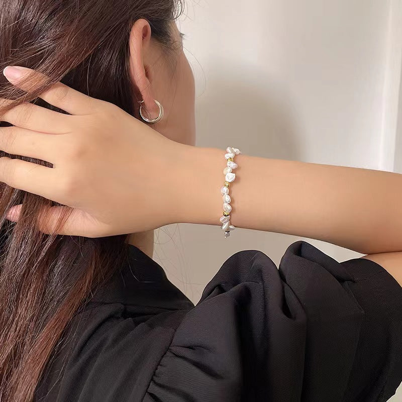 Pulsera de plata maciza S925 con auténtica perla barroca.