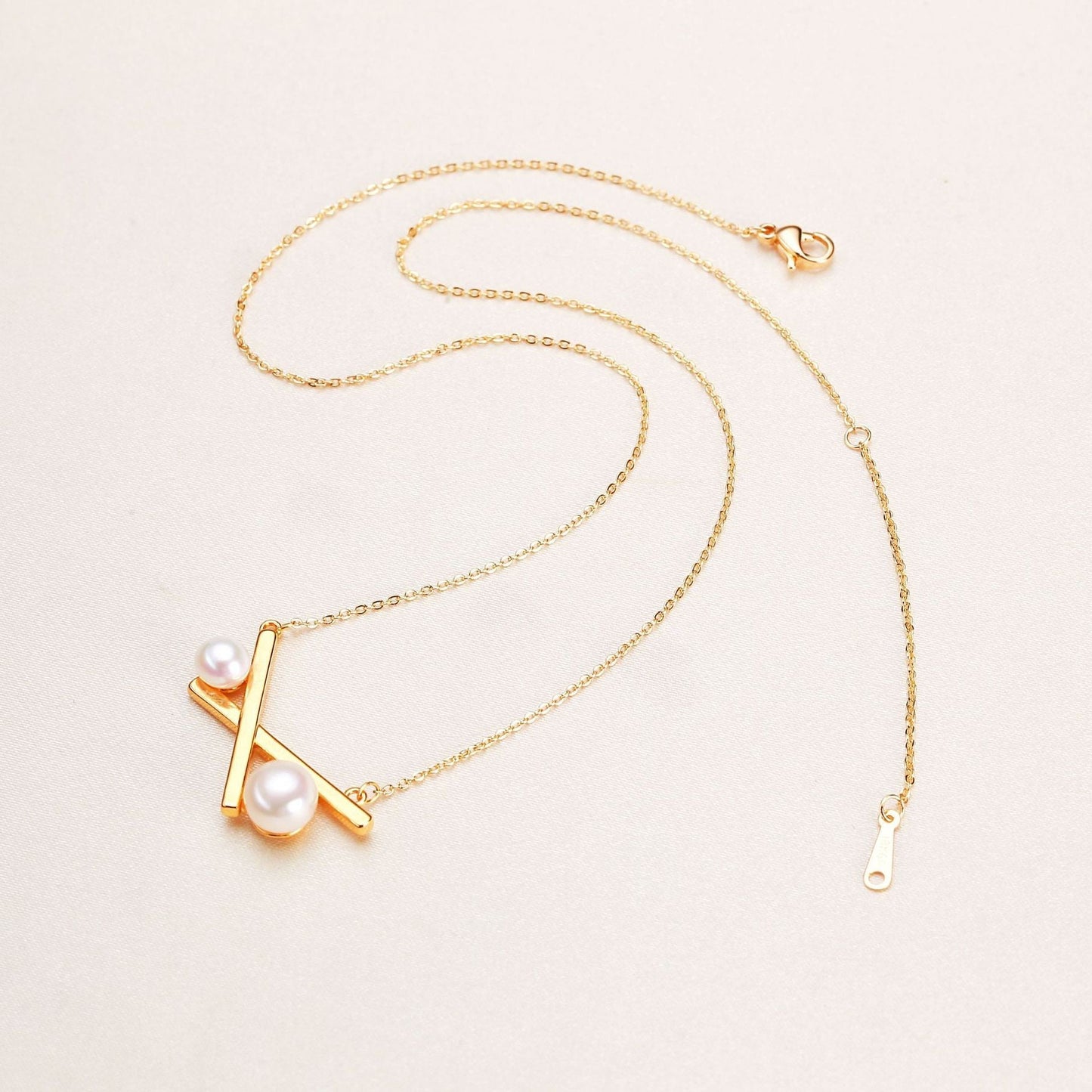 Collar de equilibrio de perlas de agua dulce genuinas bañado en latón y oro de 18 quilates