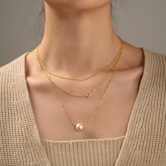 Collier à couches dorées en véritables perles d'eau douce
