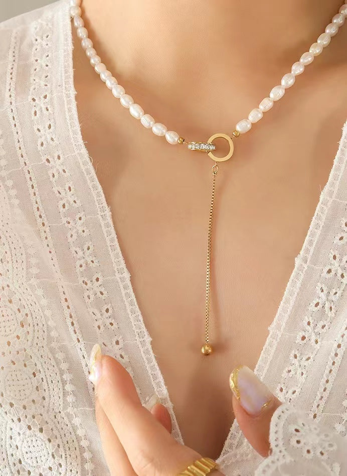 Collar de acero y titanio con forma de círculo de la esperanza y perla de agua dulce auténtica