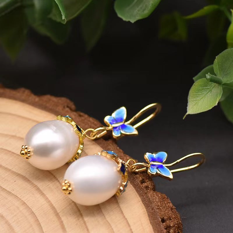 Pendientes de mariposa azul con auténtica perla barroca de agua dulce (edición limitada)