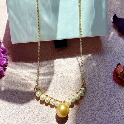 Collier en V avec véritables perles d'eau douce de 12 mm