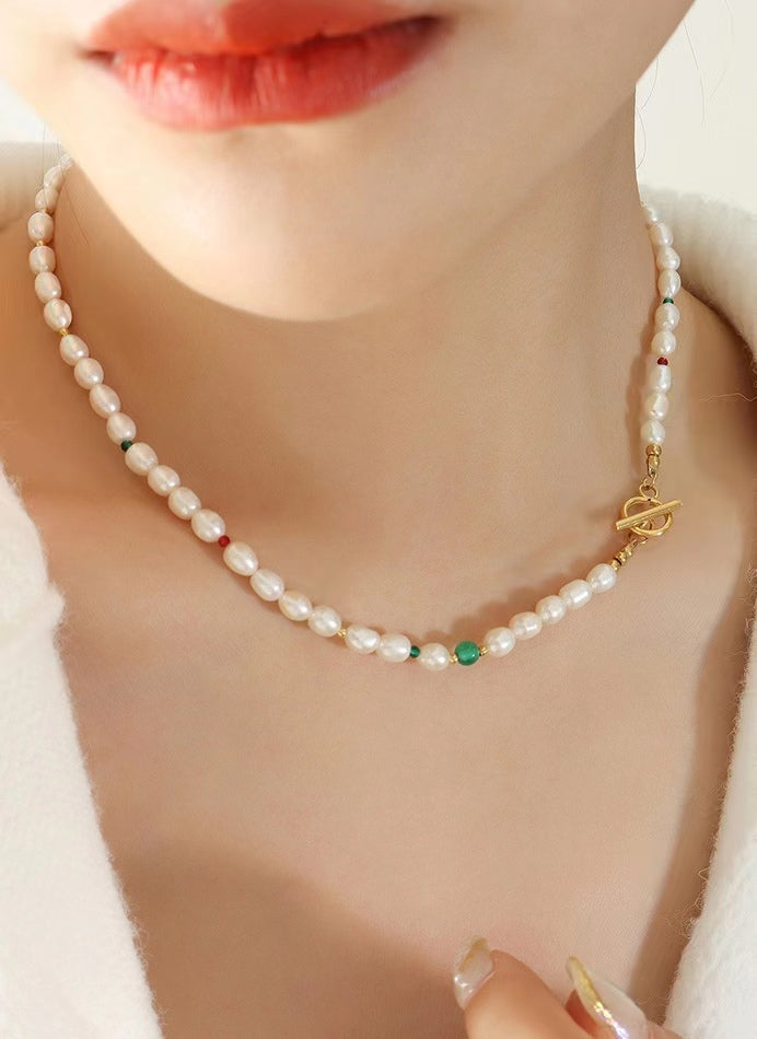 Collar de ojo verde de acero y titanio con perla de agua dulce genuina