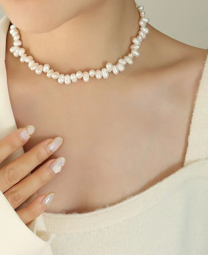 Collar de arroz de acero y titanio con perla de agua dulce genuina