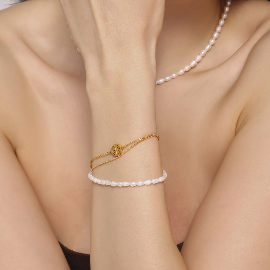 Pulsera Lucky Dew de acero y titanio con perla de agua dulce genuina