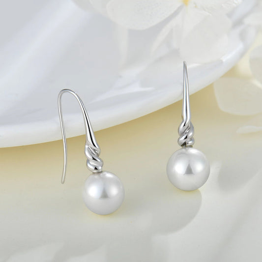 Boucles d'oreilles torsadées en argent et véritables perles d'eau douce