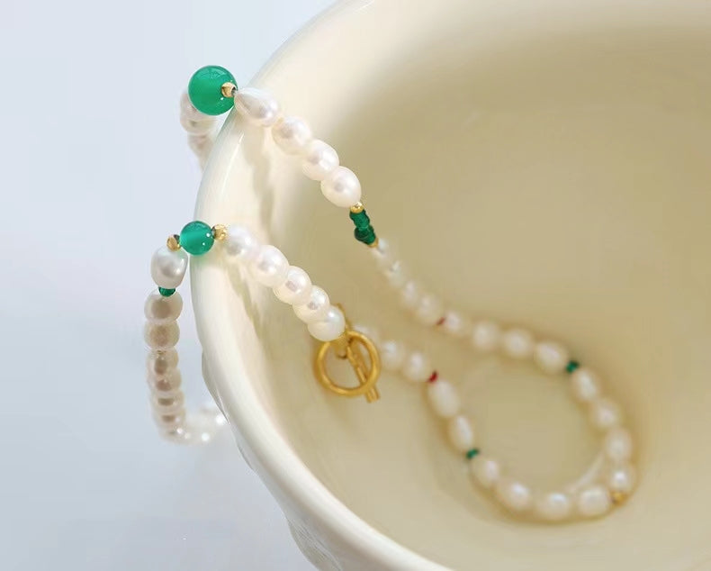 Collar de ojo verde de acero y titanio con perla de agua dulce genuina