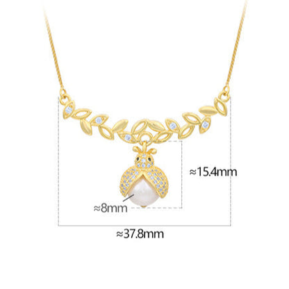 Collar de escarabajo con diamantes y perlas barrocas auténticas de plata maciza S925