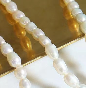 Collar D de acero y titanio con perla de agua dulce genuina