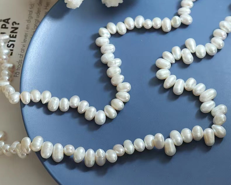 Collar de arroz de acero y titanio con perla de agua dulce genuina