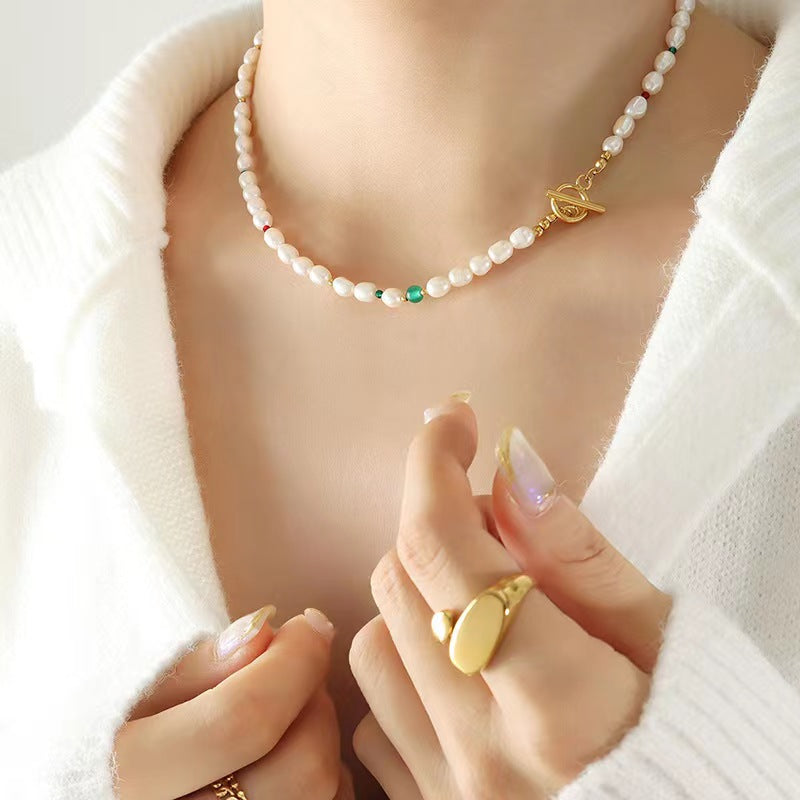Collar de ojo verde de acero y titanio con perla de agua dulce genuina