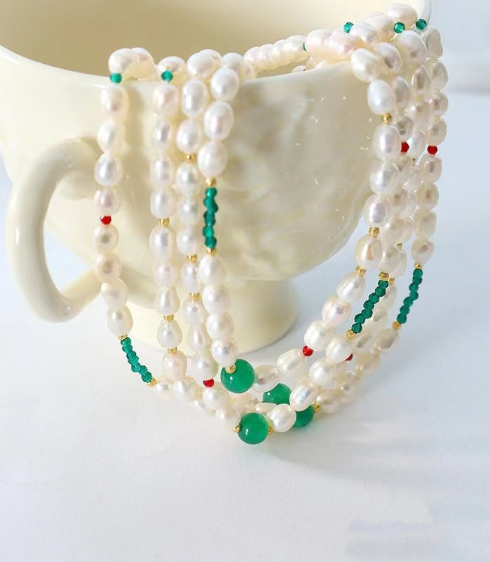 Collar de ojo verde de acero y titanio con perla de agua dulce genuina