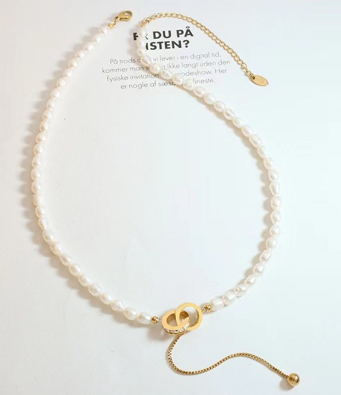 Collar de acero y titanio con forma de círculo de la esperanza y perla de agua dulce auténtica
