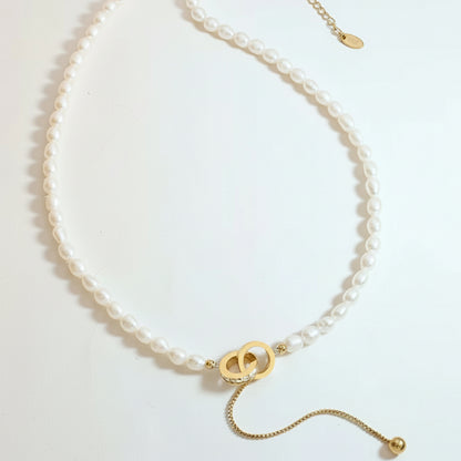 Collier Cercle d'espoir en acier titane et perles d'eau douce véritables