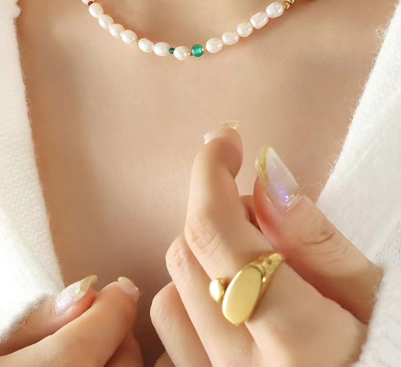 Collar de ojo verde de acero y titanio con perla de agua dulce genuina