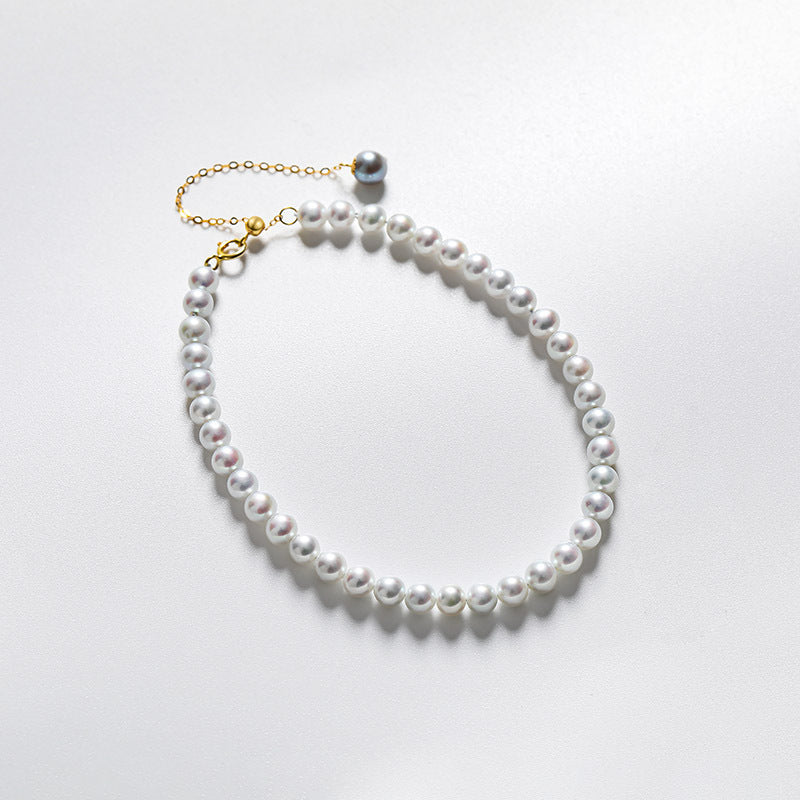 Bracelet en or massif 18 carats et véritable perle d'eau douce au mercure