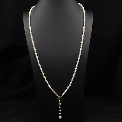 Collar Éblouissant de cola de elfo con perlas de agua dulce genuinas