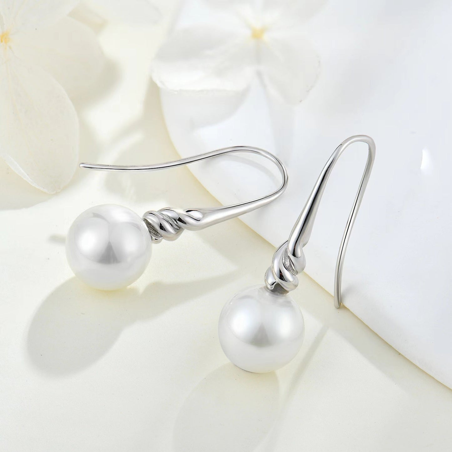 Boucles d'oreilles torsadées en argent et véritables perles d'eau douce